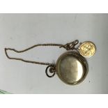 A gold plated pocket watch with attached 9 ct gold