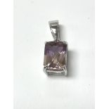 A 9ct white gold pendant set with ametrine, with c