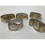 Five vintage gold tone gents wristwatches.