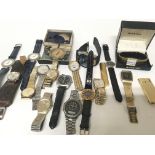 A collection of vintage gents watches and lighters