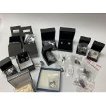 A collection of 18 brand new pairs of silver earri