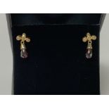 A pair of 9ct yellow gold drop earrings set with M