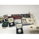 A collection of silver proof coins and other proof