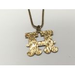 A 9carat god H letter pendent with attached chain