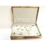 A box containing 23 new silver and silver gilt rin