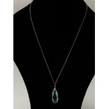 A 9ct gold blue topaz drop pendant.