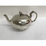 A Victorian silver tea pot the hinged lid with flo