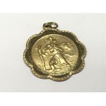A 9ct gold St Christopher pendent. Weight 4g