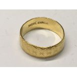 A 22carat gold wedding ring with a patterned edge