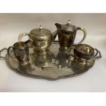 A five piece silver tea set comprising tea pot, ho