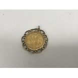 A 1882 full sovereign on mount total weight 10.5 g