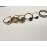 A collection of 9ct gold rings and an 18ct gold ri