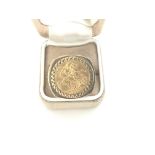 1875 Melbourne sovereign in 9ct mount. Approximate