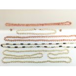 A collection of Pearl and Stove necklaces includin