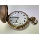 A gold plated pocket watch.