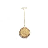 A gold Arabic coin in 9ct mount. 10g total weight