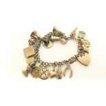 9ct Gaelic charm bracelet. Approximately 23g.