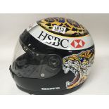 A racing helmet copy of the Eddie Irvine helmet from the 2000 Formula 1 Jaguar season.