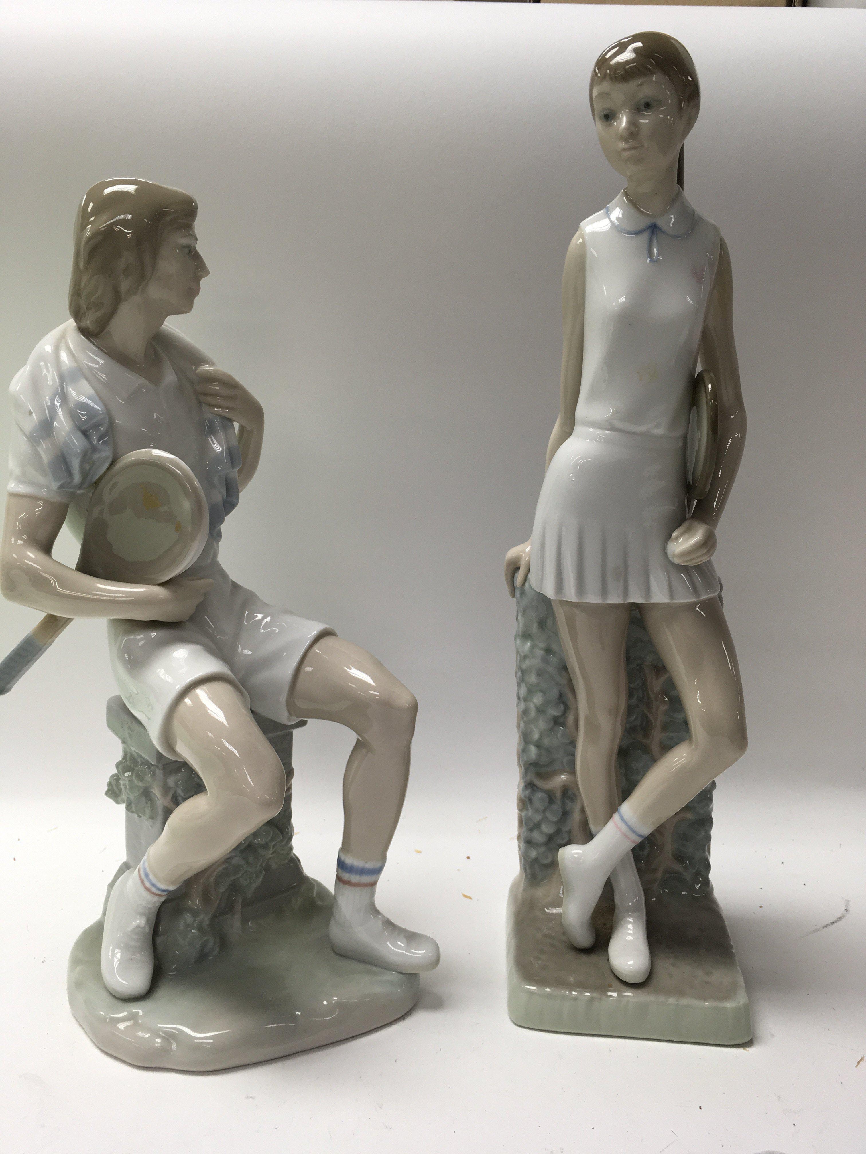 A pair of Lladro figures I. The form of tennis pla