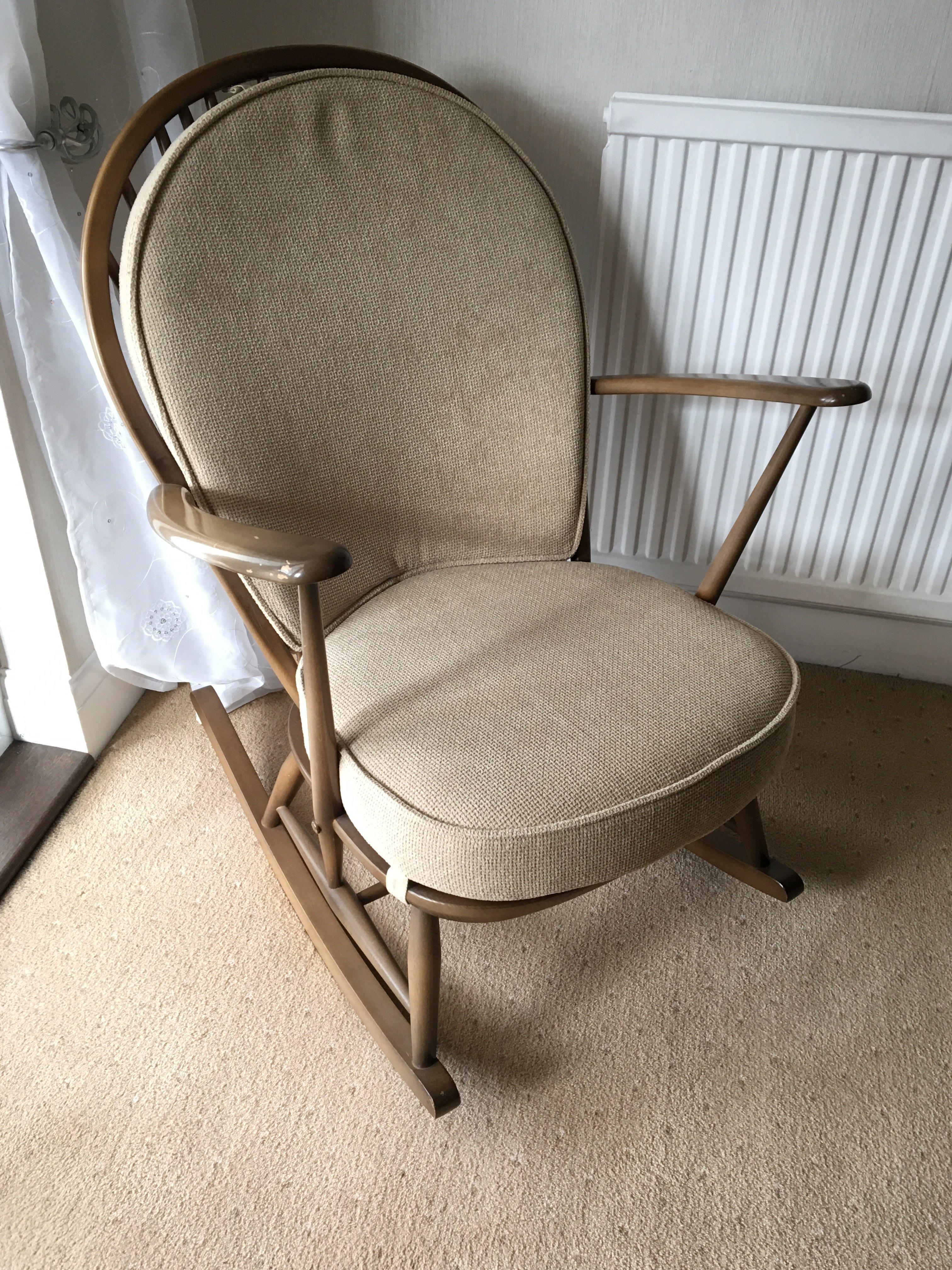 An Ercol rocking chair with cushion. Approx sizes