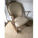 An Ercol rocking chair with cushion. Approx sizes
