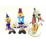 Collection of clown figures including two which ar