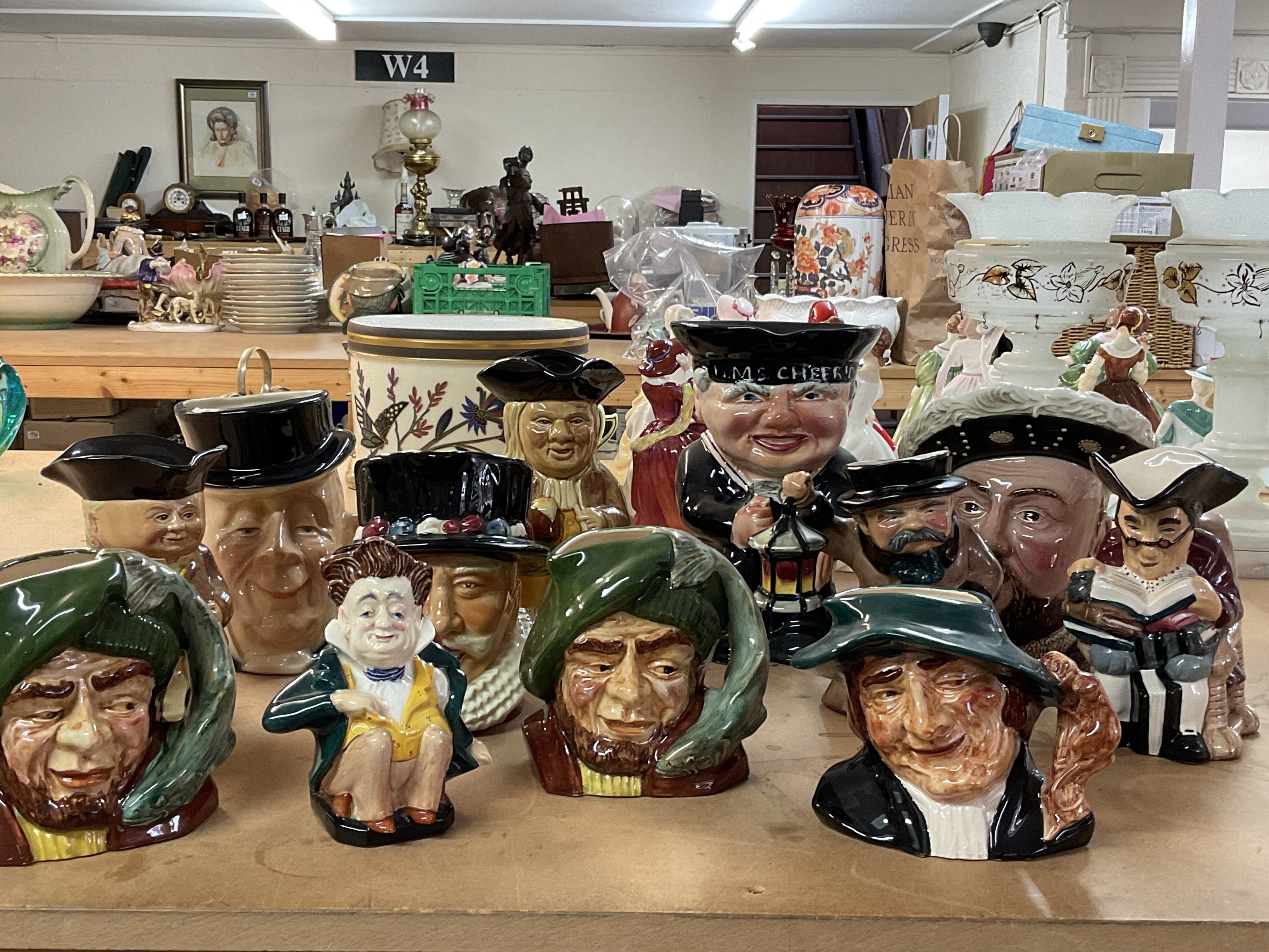 A collection of various character jugs including S