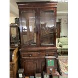 A Victorian mahogany glazed front bookcase. 227cm