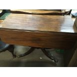 A Regency mahogany breakfast table the twin flap t