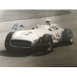 A framed and signed photograph of Sterling Moss in