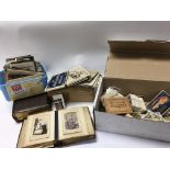 A box of mixed ephemera including postcards, cigar