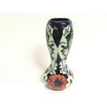 A Moorcroft pottery poppy vase designed by Rachel