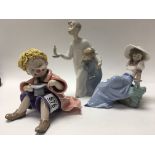 Lladro figures together with a seated clown with w