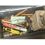 A metal box containing wood working tools and a ma