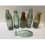 Six vintage bottles, including two codd neck bottles, one for R. White.