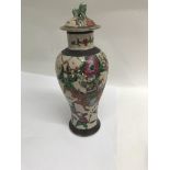 A Chinese vase decorated with warriors on a crackl