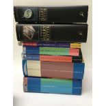Seven Harry Potter books, four are first editions.