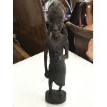 A heavy carved native standing figure - NO RESERVE