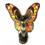 A table lamp in the form of a fairy.
