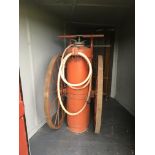A Rare large Air Minister Aircraft runway fire extinguisher on large cast wheels. 162cm high.