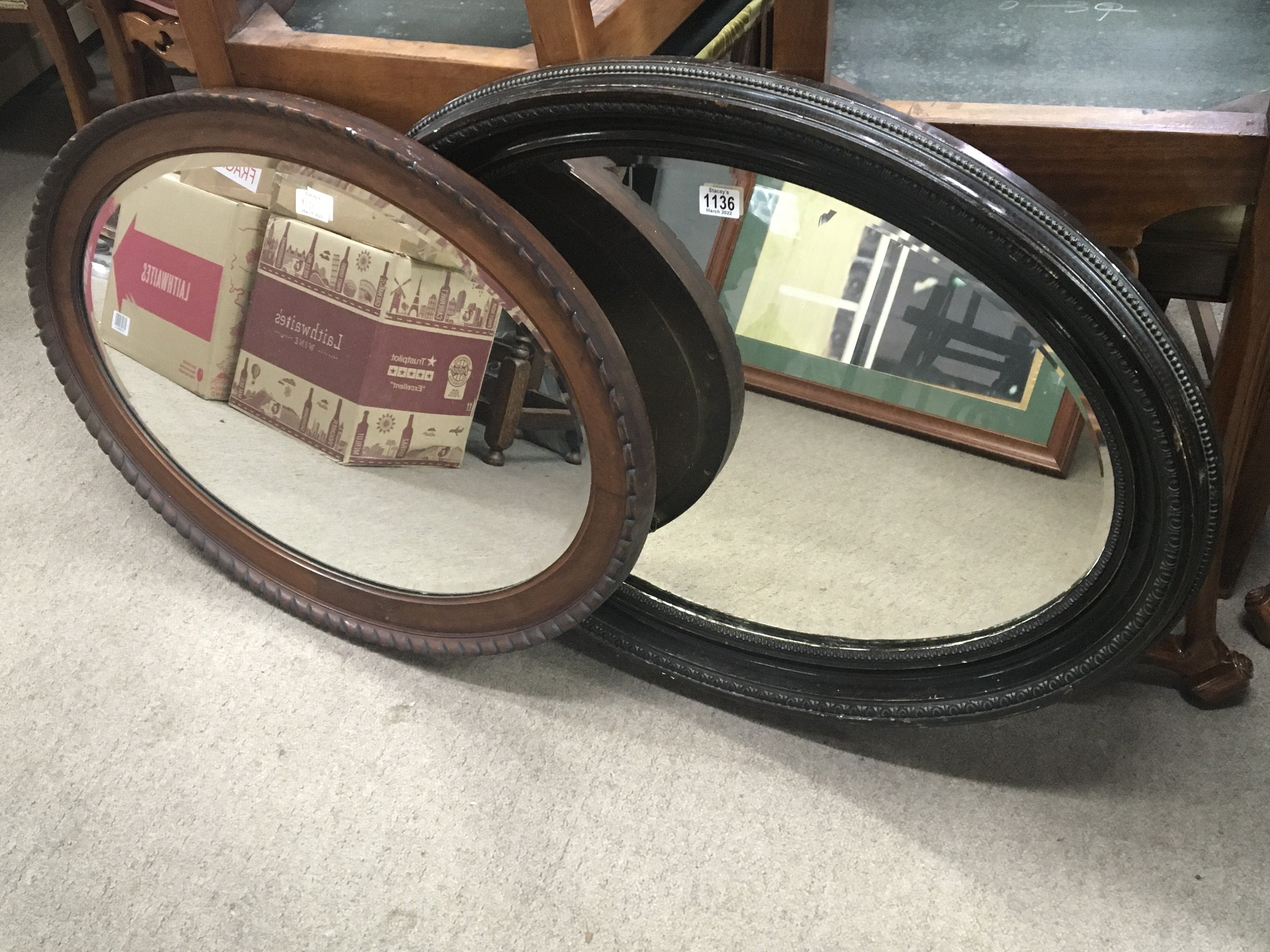 Two oval framed wall mirrors with bevelled edge. 8