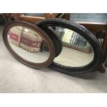 Two oval framed wall mirrors with bevelled edge. 8