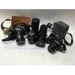 A small collection of cameras and lenses.