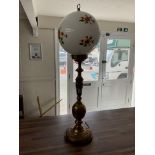 A large brass table lamp with dragon design. 85cm.