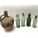 Four interesting Victorian glass bottled with orig