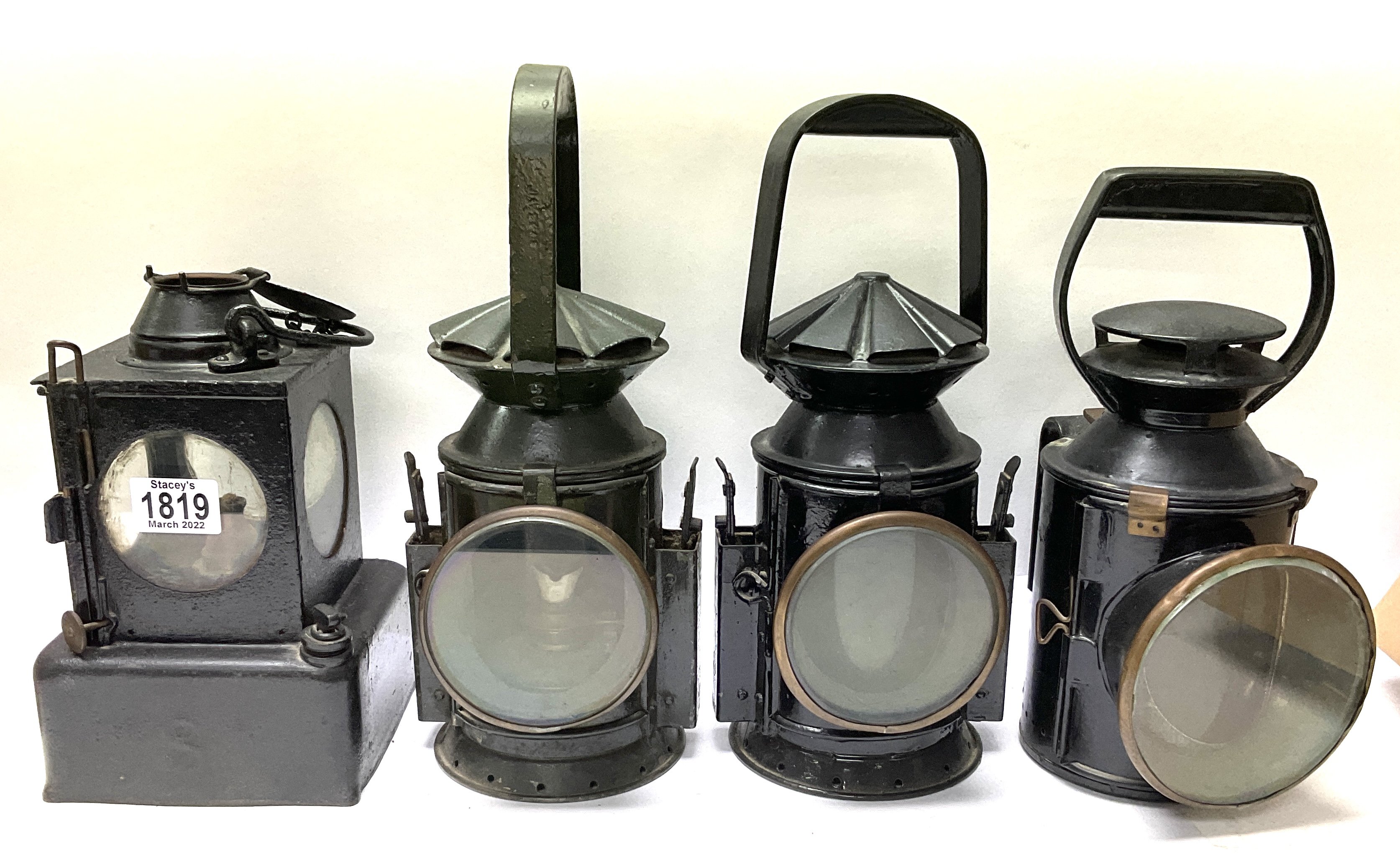 4 Antique Railway lanterns to include 1 LNER square body lantern, 2 Military issue signal lamps