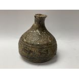 An Early unusual lead body vessel with cast images
