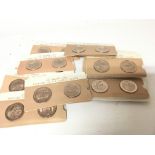A collection of unopened bronze coin medallions Th
