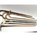 Collection of seven vintage walking sticks and can