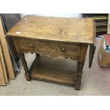 A solid oak drop leaf occasional table the twin fl
